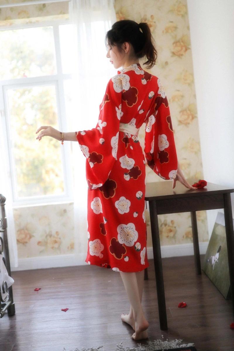 Alt text:Back view of model wearing red floral kimono inspired lingerie with sash belt