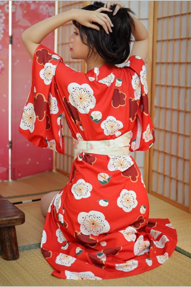 Alt text:Back view of red floral wholesale kimono loungewear for women with traditional obi sash
