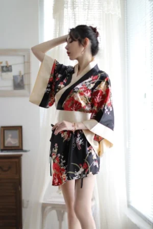 Model wearing black floral japanese kimono nightwear with ivory trim