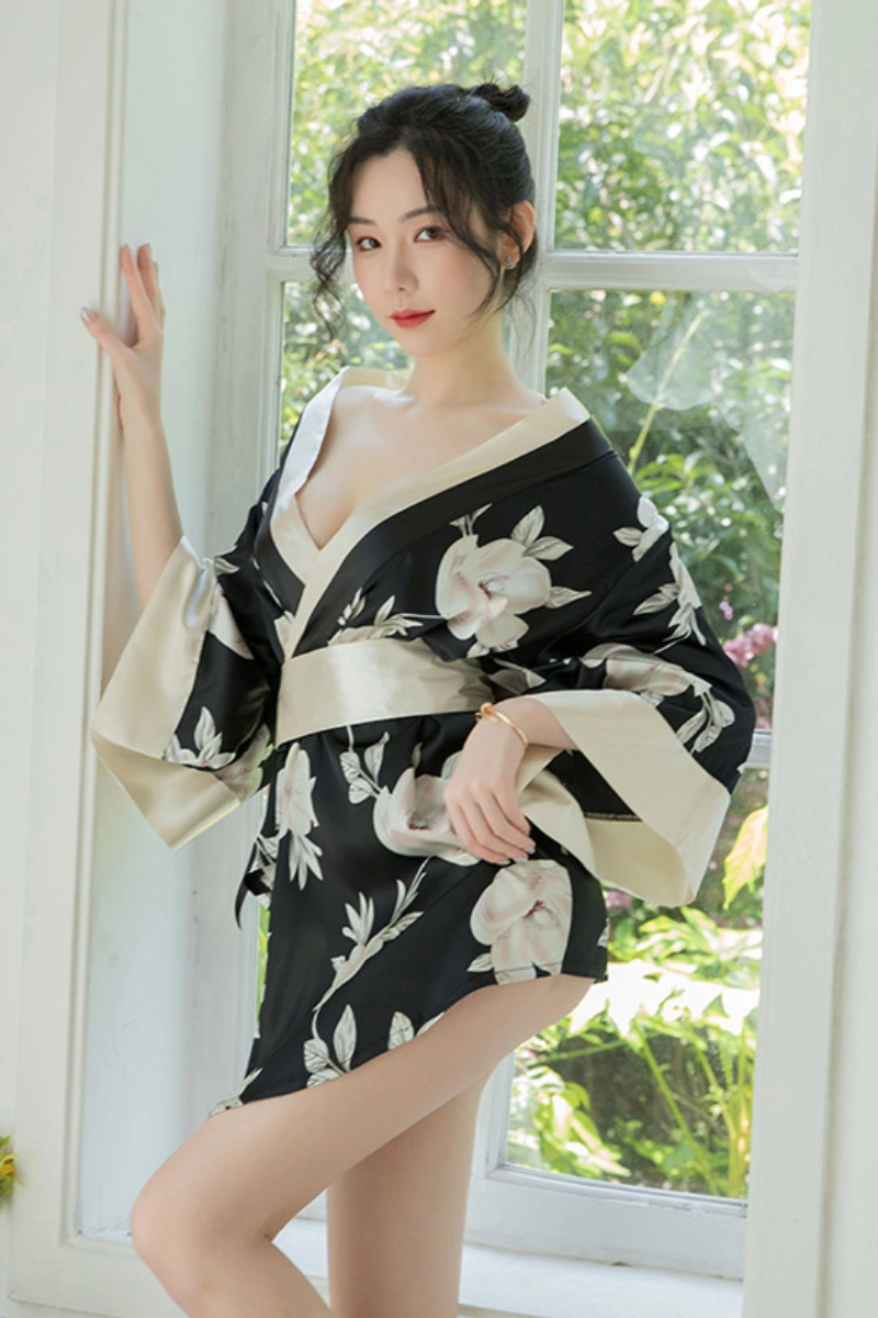 Model wearing black floral japanese kimono nightwear with white floral prints