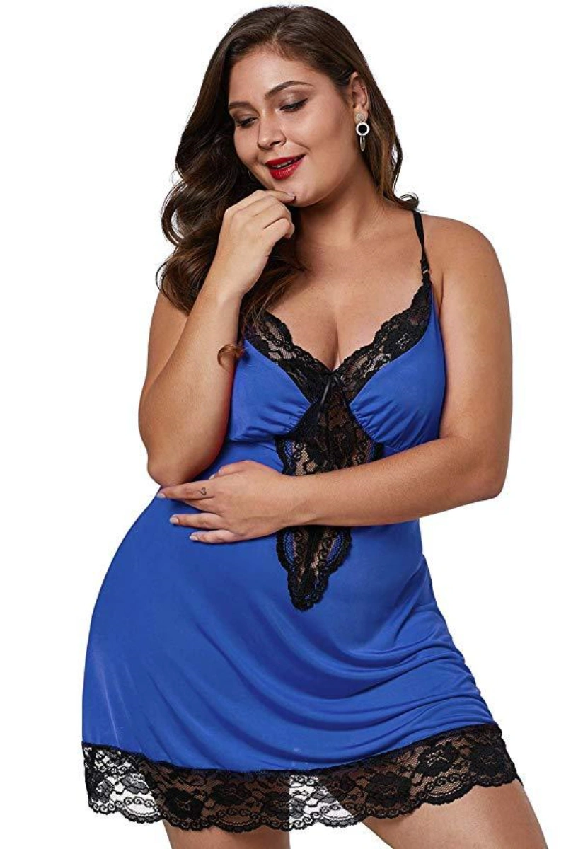 Alt Text: Plus size blue leopard print babydoll with delicate black lace accents