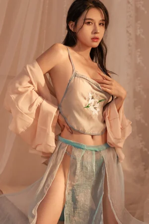 Model wearing sheer blue lace hanfu lingerie with embroidered floral design