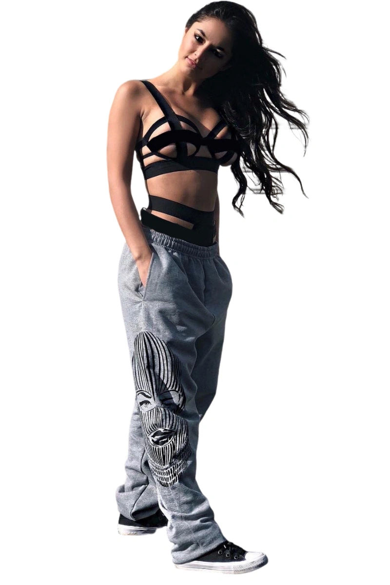 Model wearing a black cut out bra and panties set with strappy high waist design, perfect for sexy lingerie collections.
