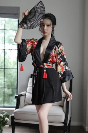 Alt Text： Model wearing elegant floral satin kimono robe lingerie with deep neckline and red tassel details