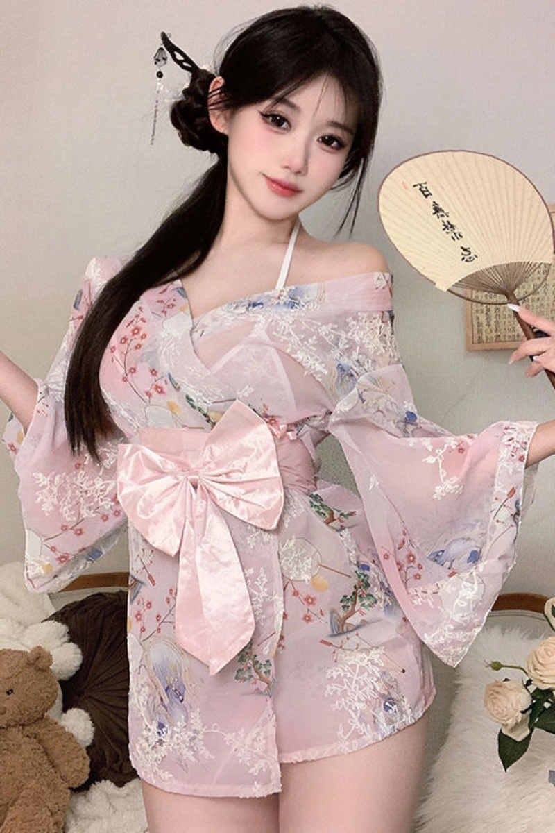 Alt Text: Model wearing a pink japanese style sexy robe with delicate floral embroidery and satin bow