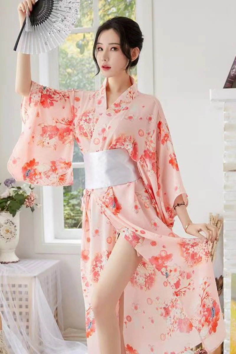 Alt Text: Satin kimono nightgown in soft pink with red floral design and white waist sash