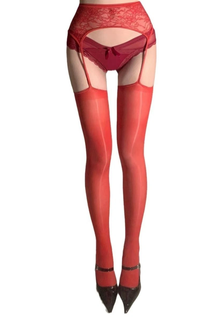 Red matte silk stockings with lace garter belt design, sexy and bold lingerie accessory.