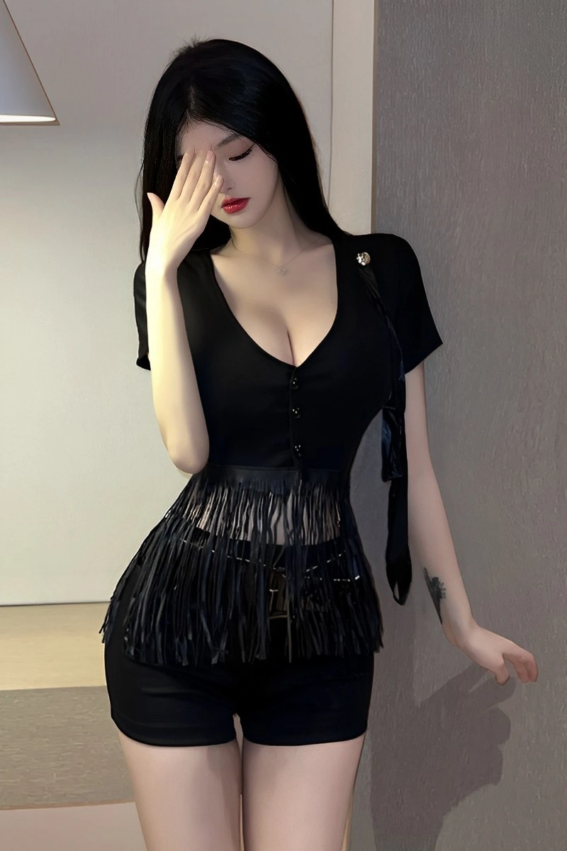 Model leaning against wall in Police Uniform Lingerie featuring a deep V-neck black crop top and shorts.