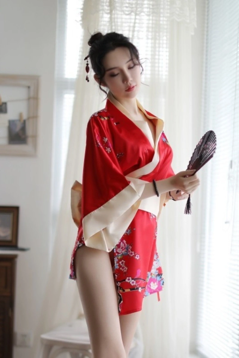 Model in red japanese kimono nightwear with floral patterns and satin trim