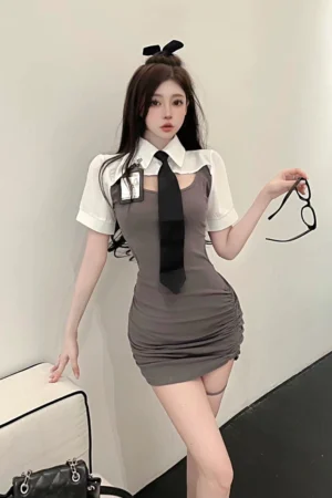 Model in Sexy Cop Bodysuit featuring a gray fitted dress, white collar shirt style, and black tie.