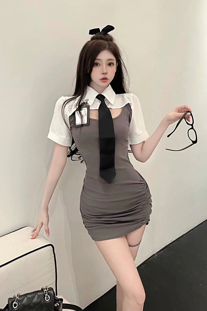 Model in Sexy Cop Bodysuit featuring a gray fitted dress, white collar shirt style, and black tie.