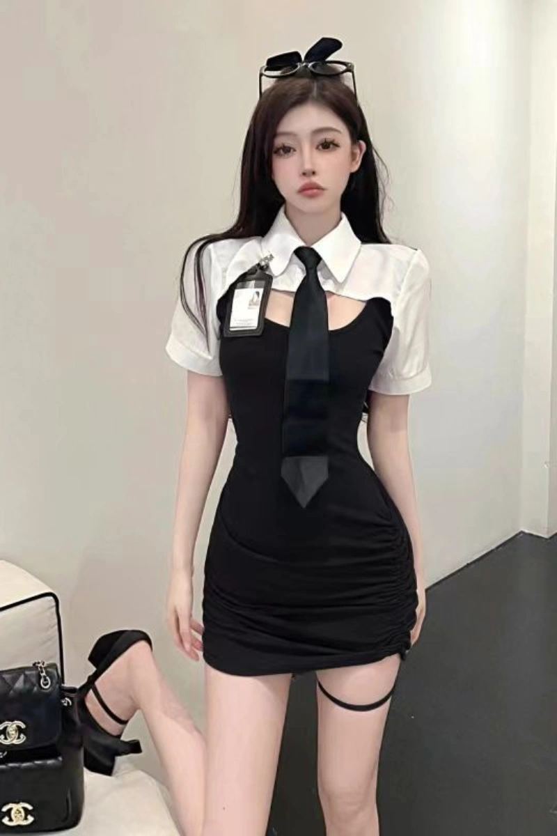 Model wearing a Sexy Cop Bodysuit featuring a black fitted dress, white collar, and matching tie.
