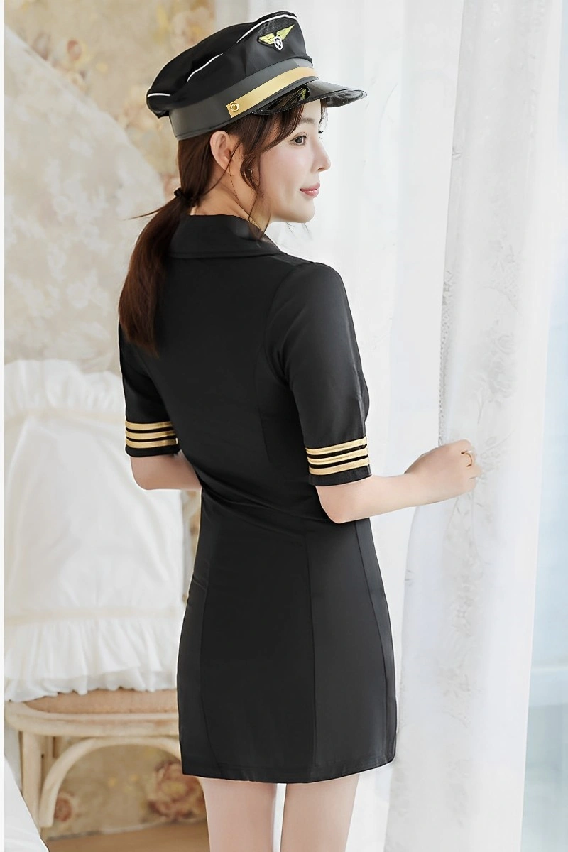 Back view of model in Sexy Flight Attendant Dress black mini with gold stripes and cap.
