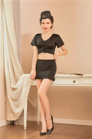 Front view of Sexy Flight Attendant Outfit in black, featuring crop top, ruffled hem mini skirt, and matching flight cap.