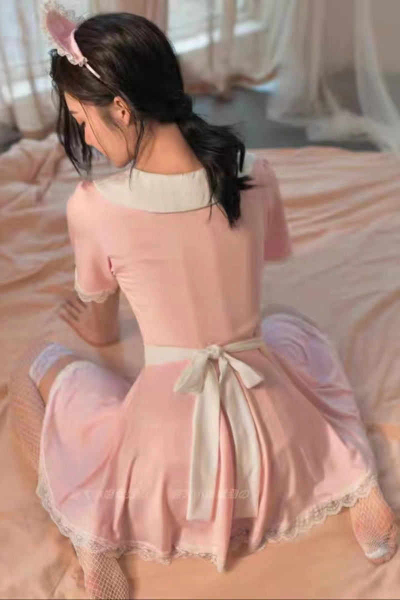 Back view of sexy nurse costume in pink showing waist tie and lace details