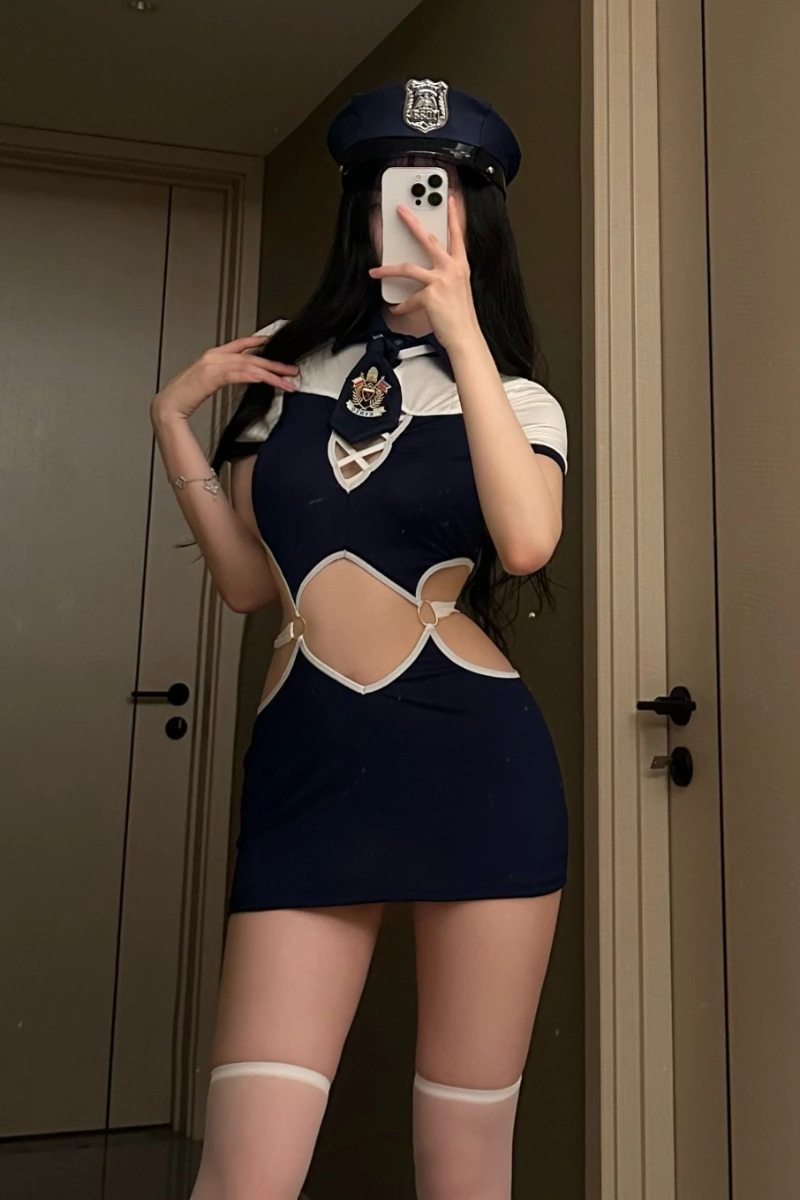 Front view of Sexy Police Roleplay Costume in navy blue with white trim, police badge, and matching cap.