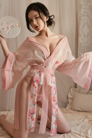 Alt Text： Model wearing sexy roleplay ancient outfit in sheer pink fabric with floral belt