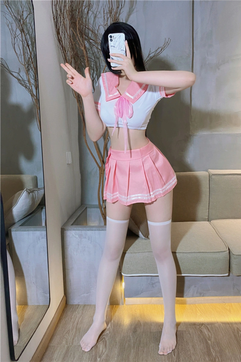 Sexy sailor schoolgirl outfit including pink pleated skirt, sailor collar, and matching bow