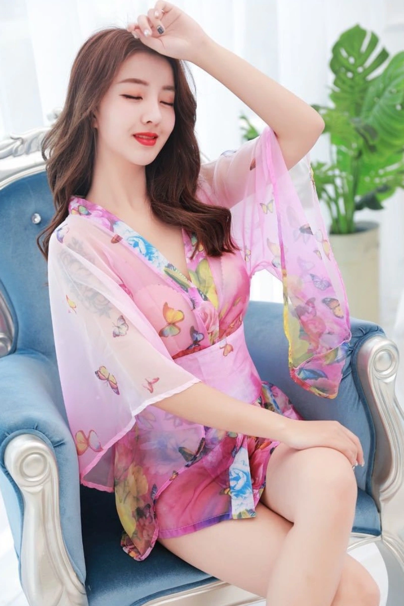 Model wearing sheer kimono robe with pink butterfly pattern
