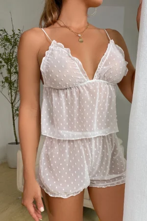 Close-up of white lace pajama lingerie set with layered mesh top and matching shorts