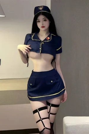 Model wearing Stewardess Costume Lingerie in two-piece navy blue outfit with gold accents and mini skirt.