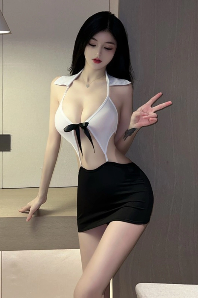Tight secretary dress featuring white halter top with black bow and fitted mini skirt