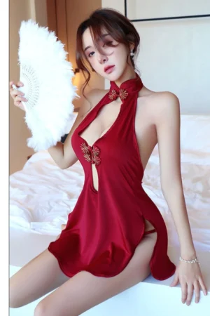 Model wearing a wholesale cheongsam lingerie bodysuit in red, featuring halter neck and keyhole design.