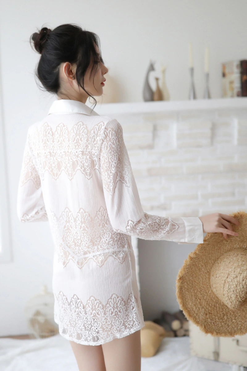 Back view of wholesale lace secretary outfit in white lace with delicate floral patterns