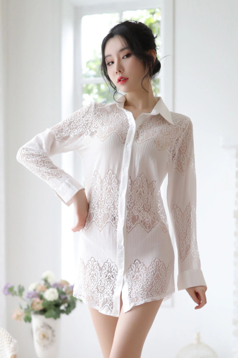 Model wearing a wholesale lace secretary outfit in white sheer lace with button-up style