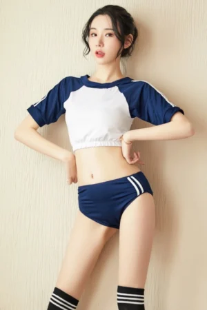 Model wearing b2b cute student uniform two-piece set with navy shorts and white-blue crop top