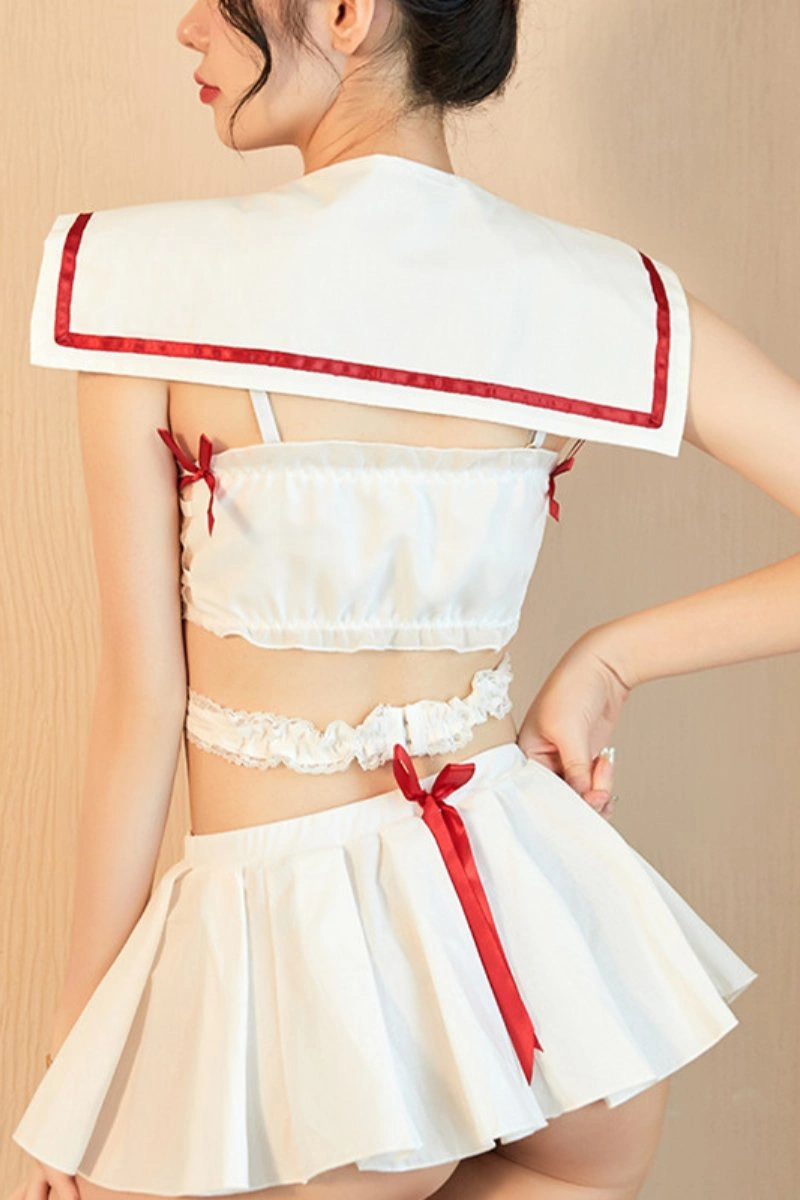 Back view of a white bulk student costume featuring a sailor-style collar and red trim
