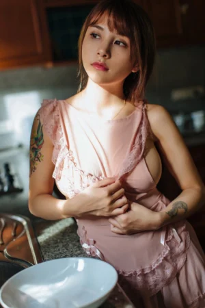 Alt Text: wholesale Lolita Maid Dress featuring soft pink fabric with delicate lace ruffles, front view