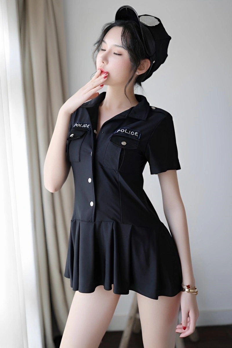 Woman dressed in a wholesale Policewoman Costume black short sleeve dress with police hat.