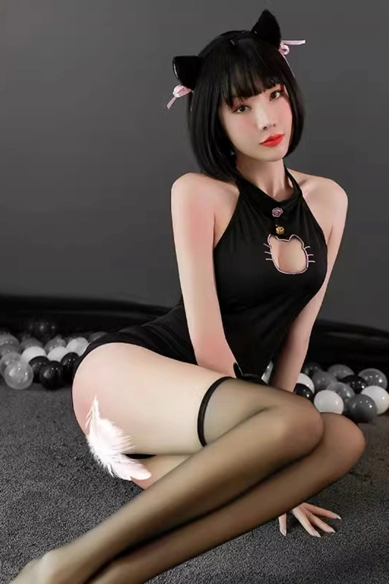 Black wholesale cat lingerie bodysuit with cat-shaped chest cut-out, paired with cat ears for a seductive cosplay look.