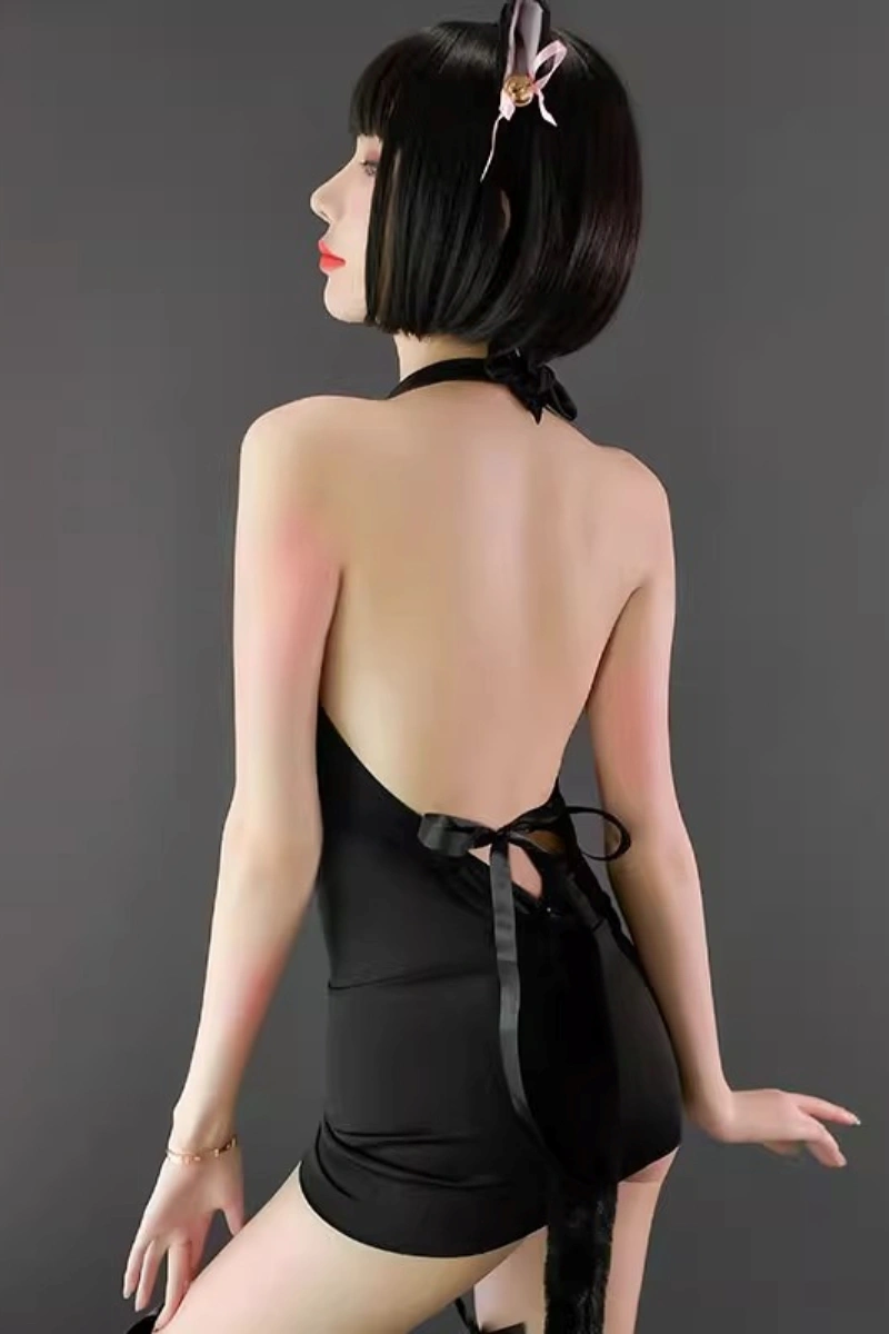 Model showing the backless style of wholesale cat lingerie bodysuit in black with ribbon tie and cosplay details.