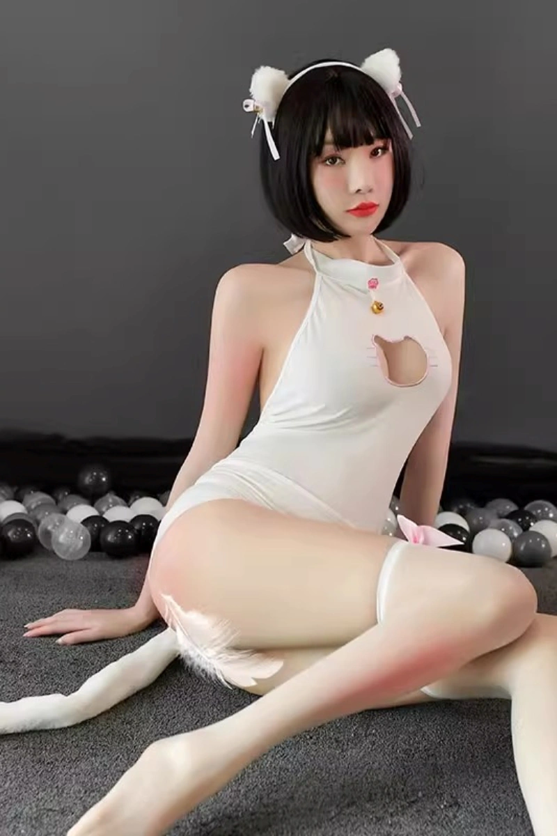 Model wearing a wholesale cat lingerie bodysuit in white with halter neckline, cat ears, and a playful cut-out design.
