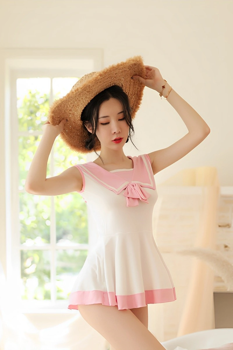 Model in wholesale cute student uniform with pink collar and flared design, tailored for bulk wholesale.
