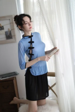 Model wearing wholesale traditional cheongsam lingerie in a sheer blue top with black accents and black skirt