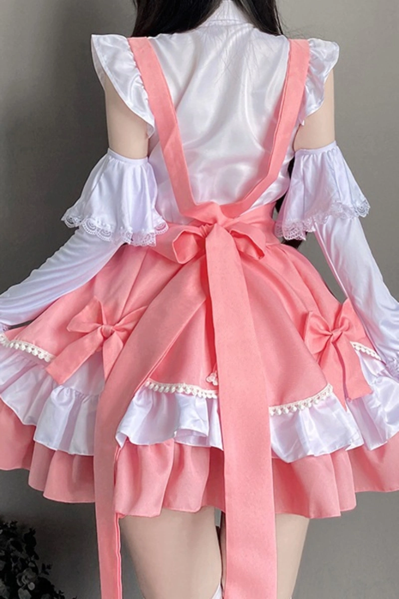 Back view of wholesale bunny lingerie clubwear in pink and white, featuring bow ties and ruffled layers.