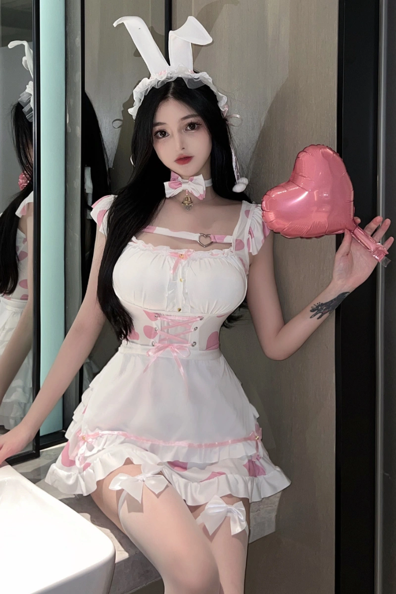 Model wearing b2b white bunny lingerie with pink heart details, lace-up waist, and bunny ear headband