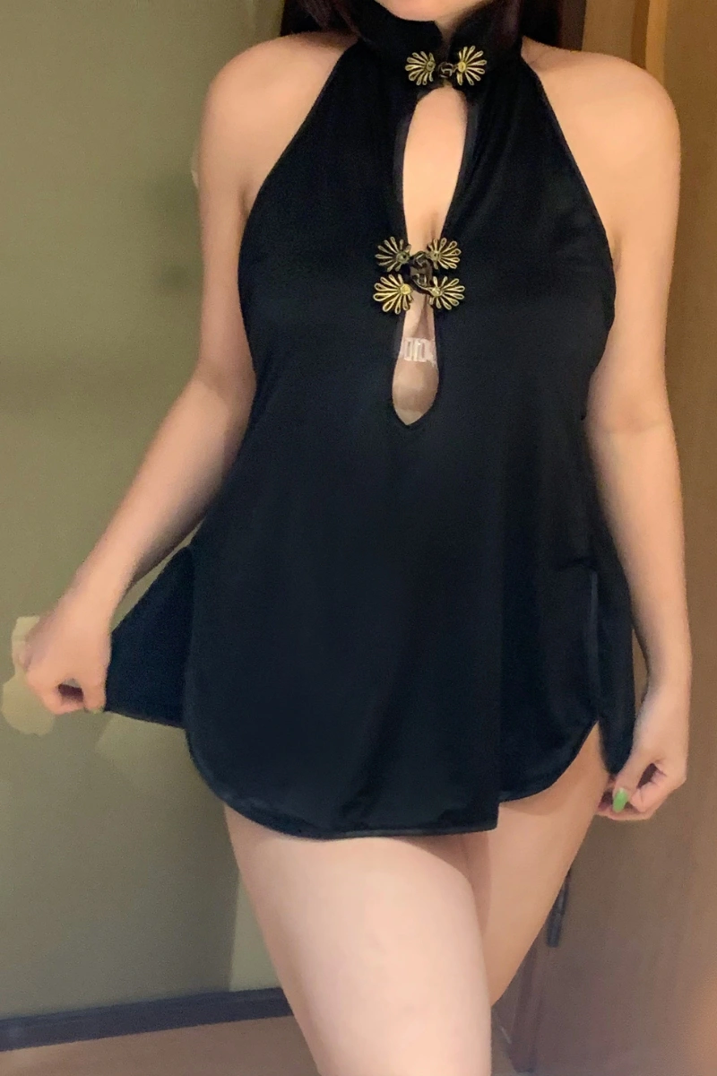 Model wearing black cheongsam lingerie for women featuring a halter neck, golden floral buttons, and open keyhole cut.