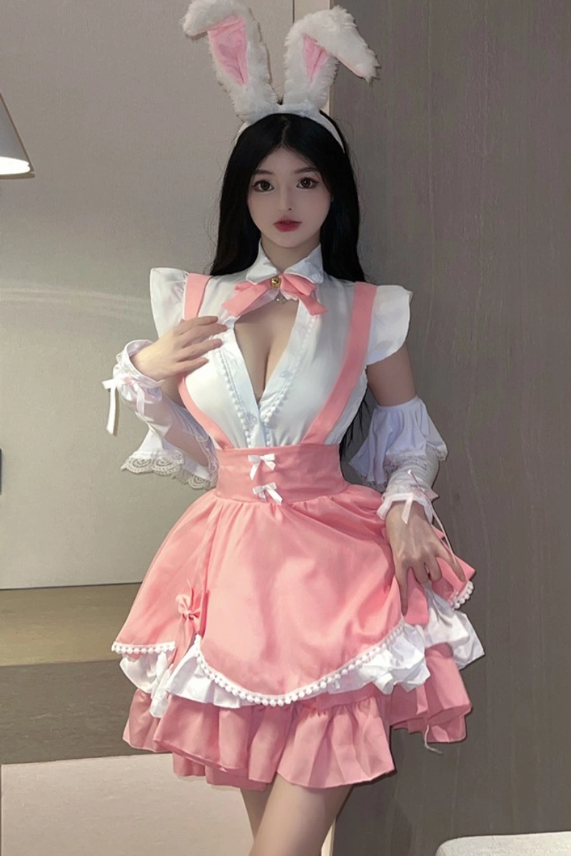 Model wearing wholesale bunny lingerie clubwear in pink and white, featuring a low-cut blouse, flared skirt, and bunny ear headband.