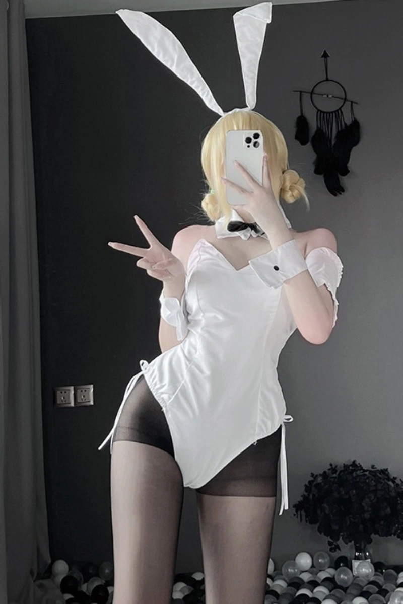 Model in wholesale erotic bunny lingerie, white satin corset with bunny ears and cuffs, designed for wholesale buyers.