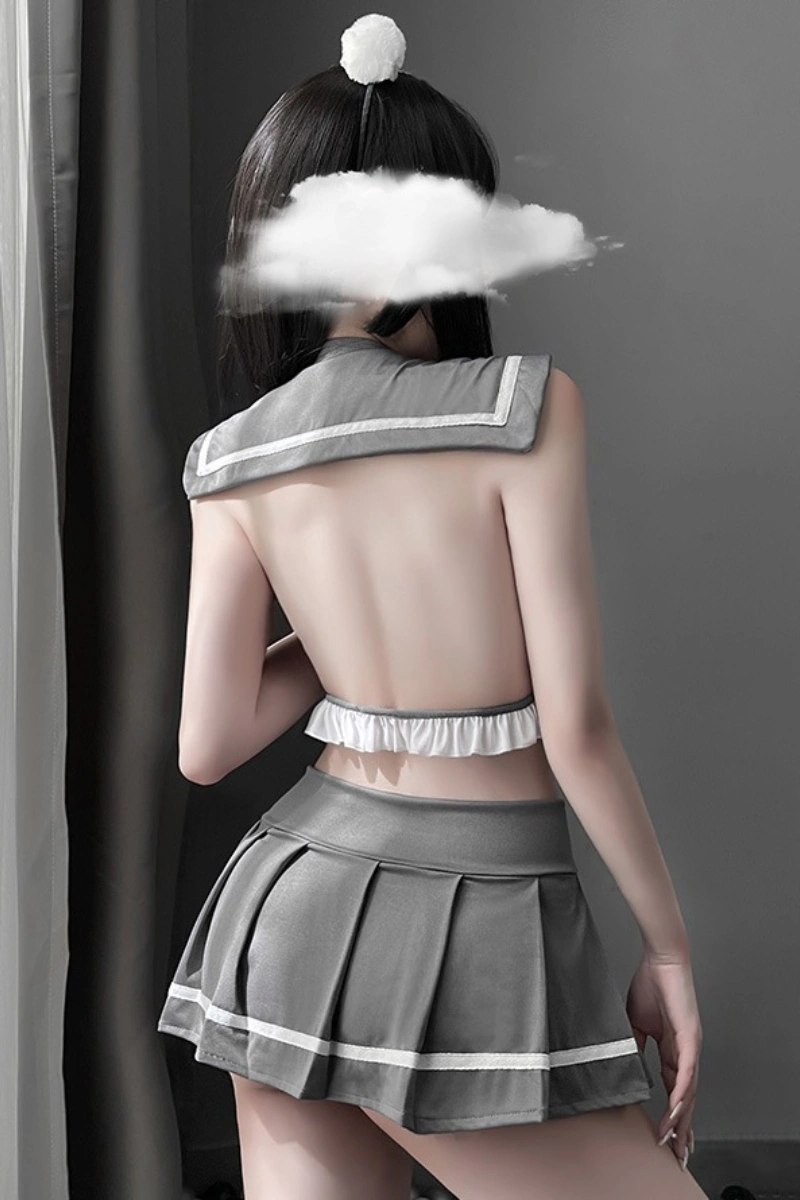 Model wearing wholesale JK student lingerie featuring sheer fabric and a short pleated skirt in gray.