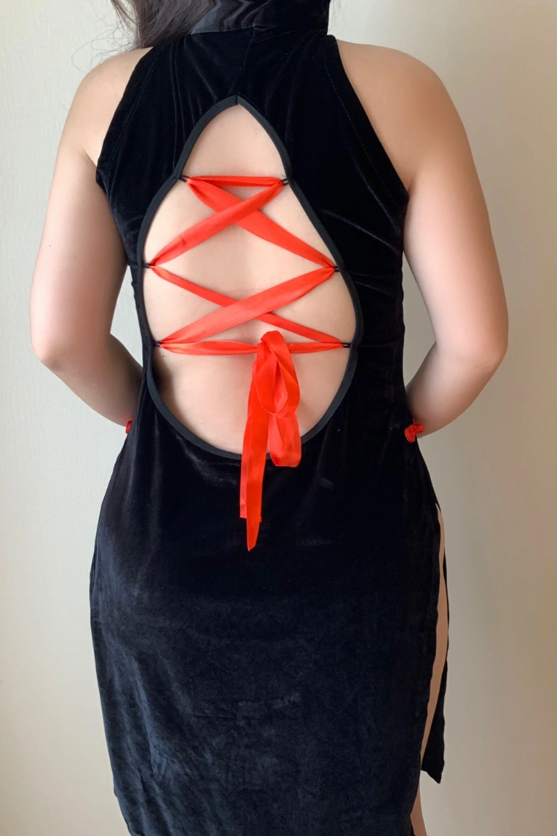 Back view of wholesale plus size cheongsam lingerie in black velvet featuring red ribbon lace-up detail.