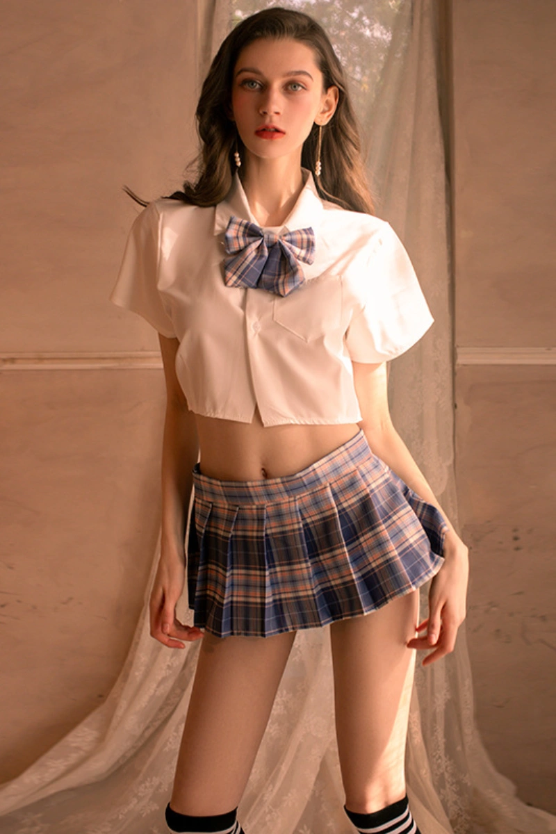 Model showing b2b Japanese JK cosplay lingerie with blue plaid mini skirt and matching bow tie.