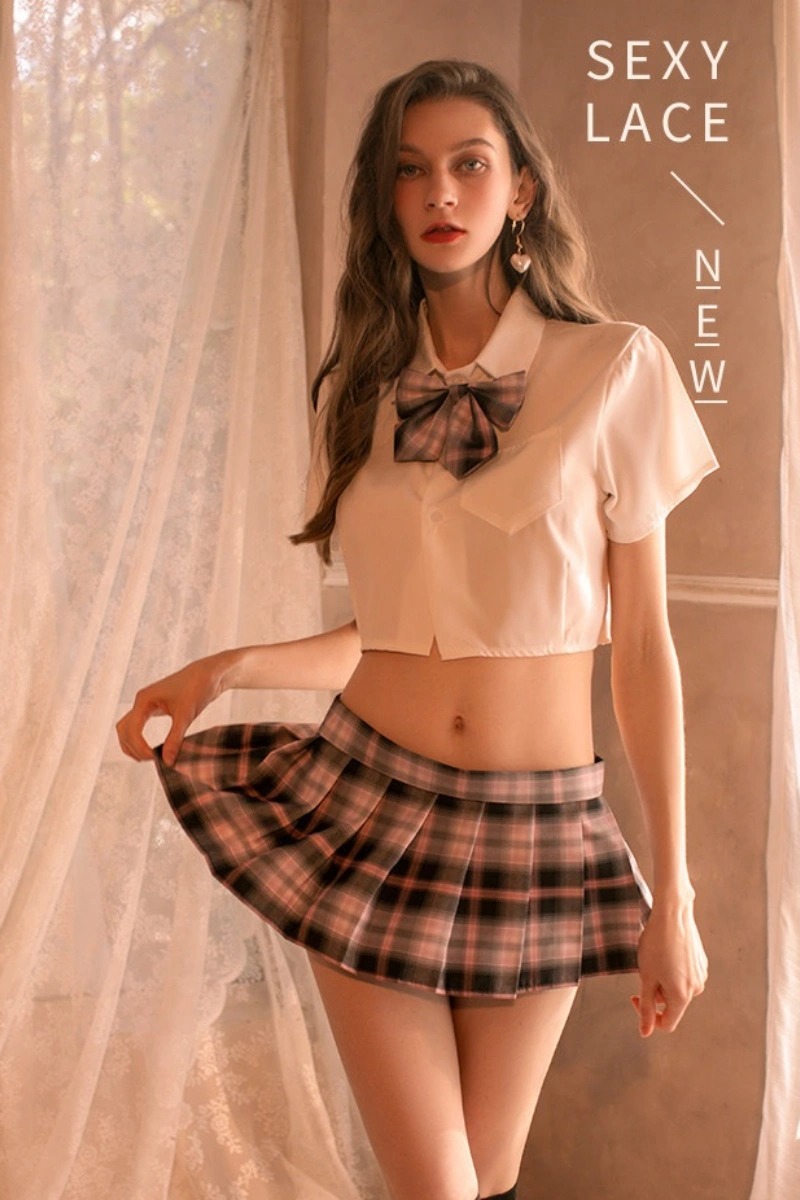 Model dressed in b2b Japanese JK cosplay lingerie with pink plaid skirt and bow tie.