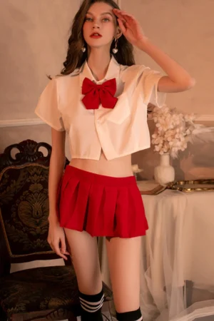 Model in b2b Japanese JK cosplay lingerie with red pleated skirt and red bow tie.