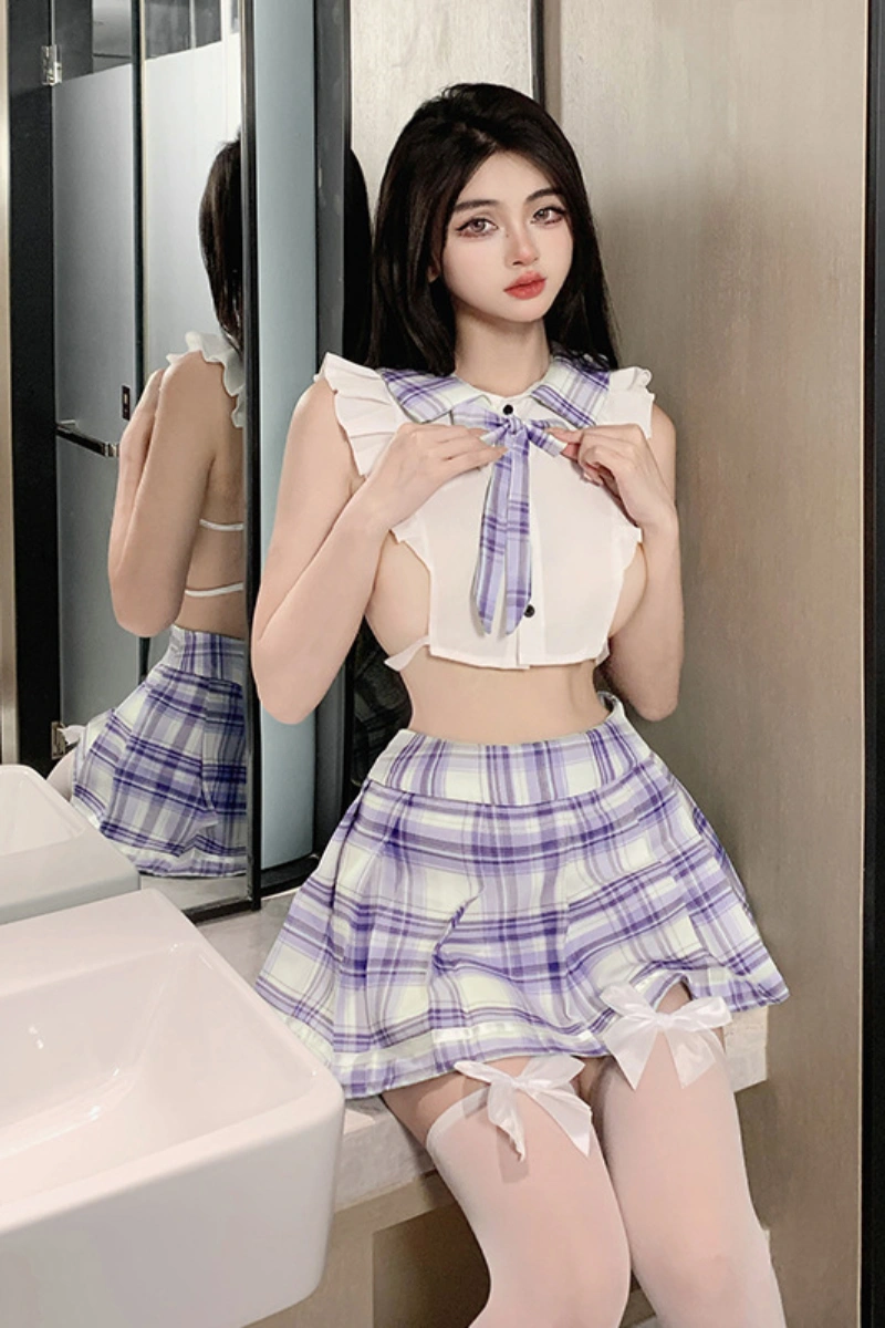 Model posing in wholesale JK sailor uniform lingerie with purple plaid skirt and matching bow collar top.