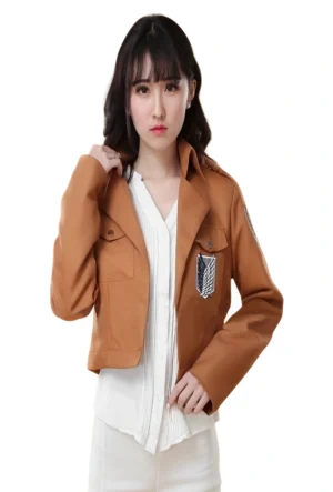 A young woman wearing a brown cropped Attack on Titan Jacket with Survey Corps emblem.